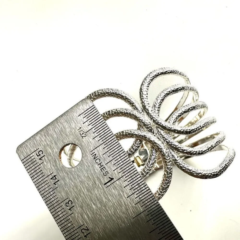 Silver tone textured hinged wide bracelet